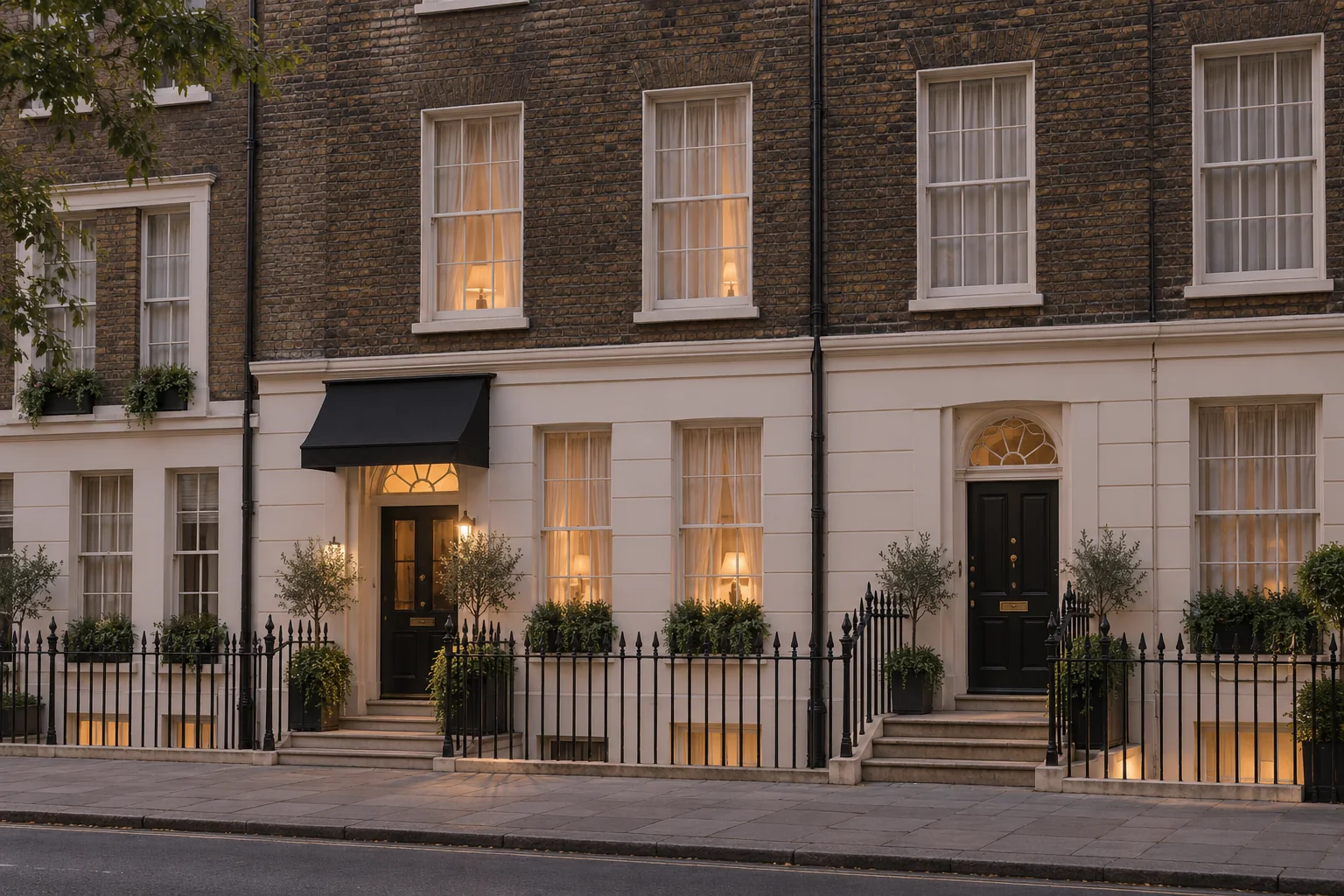 Townhouse frontage with stock brick, pale stucco, sash windows and painted railings